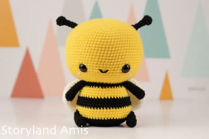 Crocheted bee toy with a colorful geometric background